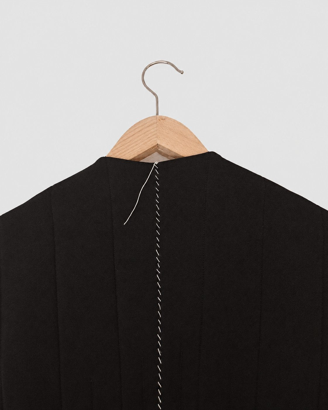 Nubi Vest Classic in Black Wool, back hand-stitching detail
