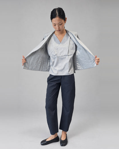Anujin wearing Nubi Vest Classic, City Grey — open front.
