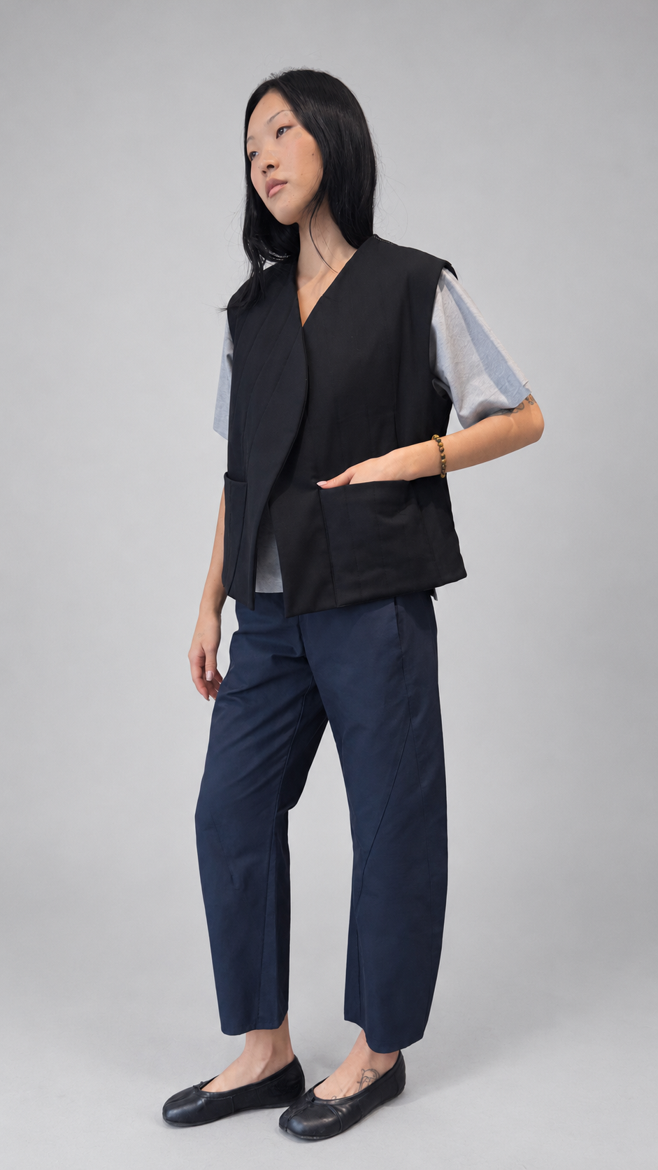 Nubi Vest Classic in Black Wool, editorial full-length side pose